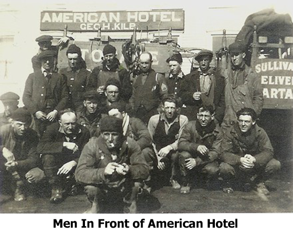 men in front of American Hotel